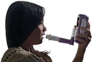 Girl with NObreath FeNO monitor for Asthma management