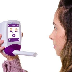 Patient completing a FeNO breath test to measure nitric oxide levels